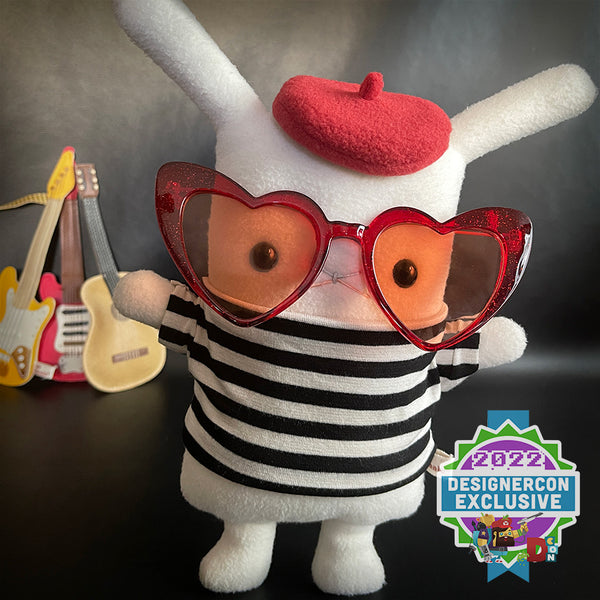 Flat Bonnie bunny plush in black & white striped tee with a red beret hat and heart shaped rose colored sunglasses.